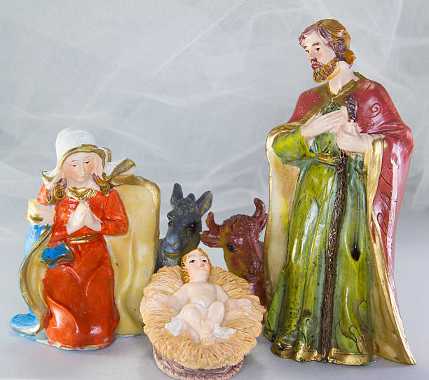 istock nativity scene with baby Jesus in the crib 521340785