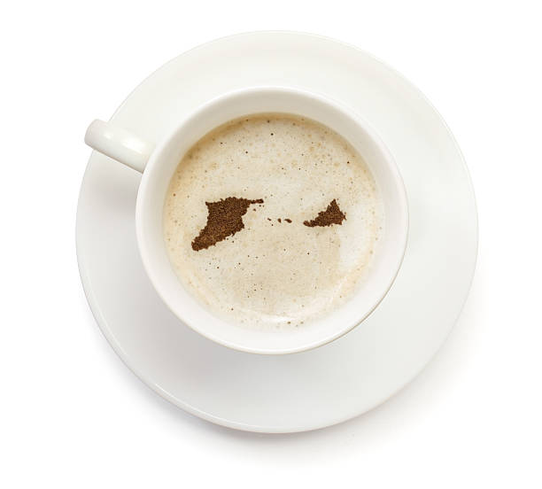 istock Coffeecup with powder in the shape of Midway Islands 521340975
