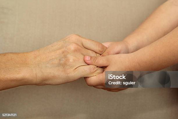 Young And Old Hands Together Stock Photo - Download Image Now - 30-39 Years, A Helping Hand, Adult