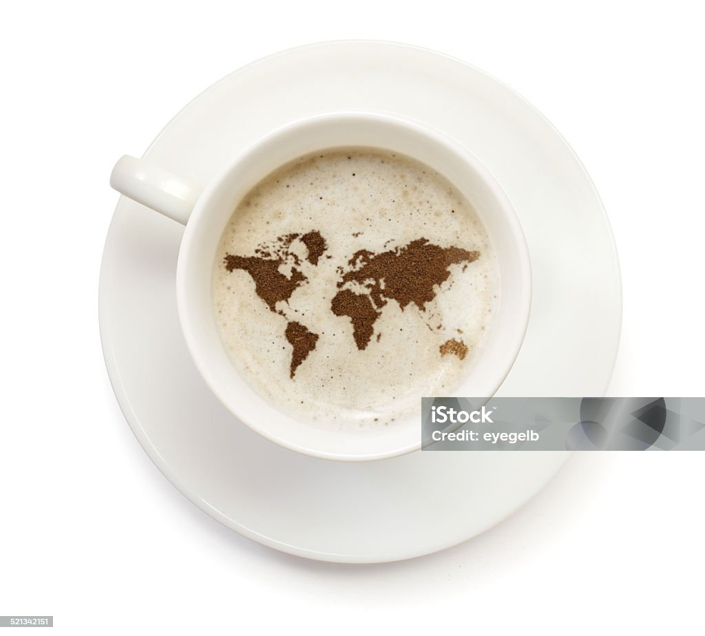 Coffeecup with powder in the shape of World A top shot of a cup of coffee with froth and powder in the shape of World (Continent).(series)   How about having a break :) Coffee - Drink Stock Photo