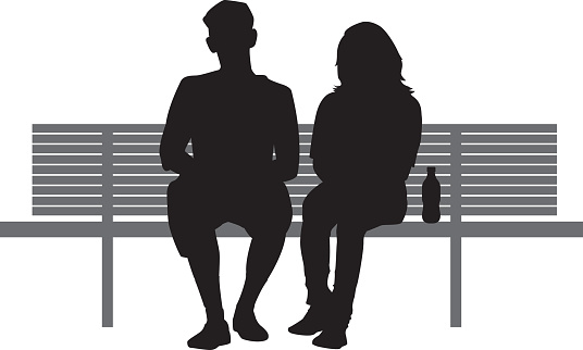 Two People Sitting on Bench