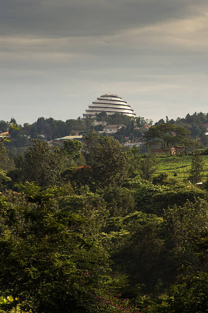 Kigali Convention Centre Trees and open space in Kigali with the Convention Centre on the horizon kigali convention center stock pictures, royalty-free photos & images