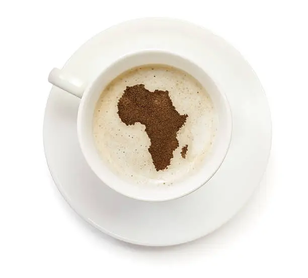 Photo of Coffeecup with powder in the shape of Africa