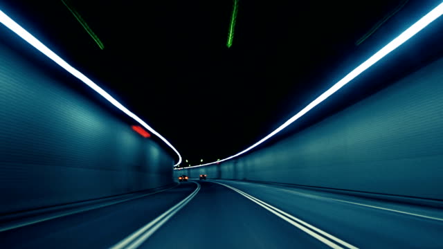 Car Dash Camera Time Lapse at Night in a Tunnel on the Highway