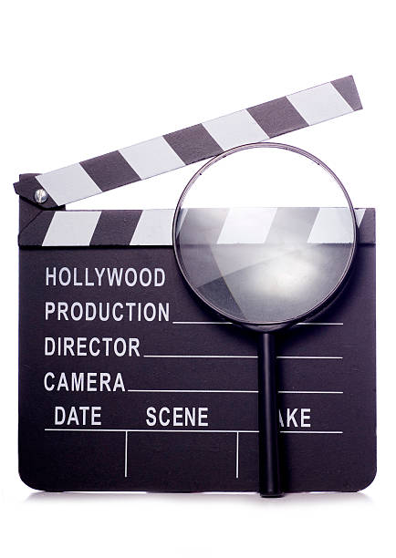 istock film clapper board with magnifying glass cutout 521344457