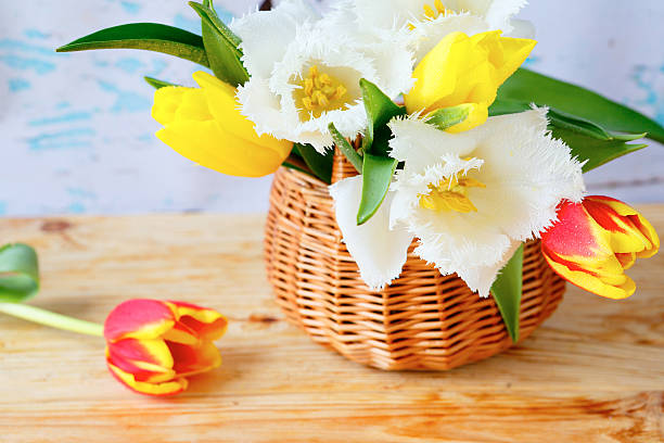 istock bouquet of tulips in a basket 521344547