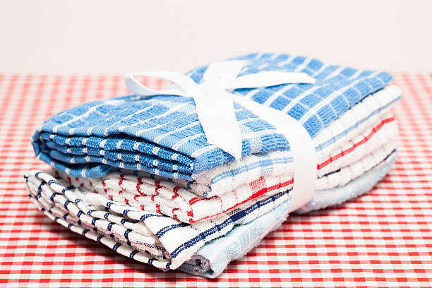 istock bundle of cleaning and drying cloths on red gingham tablecloth 521345429