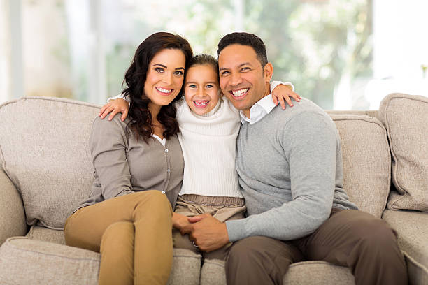 istock family sitting at home 521346729