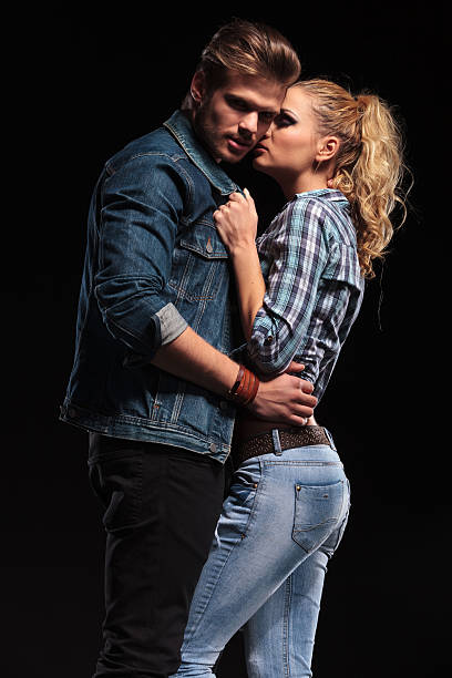 istock Woman pulling her boyfriend close to her 521347009