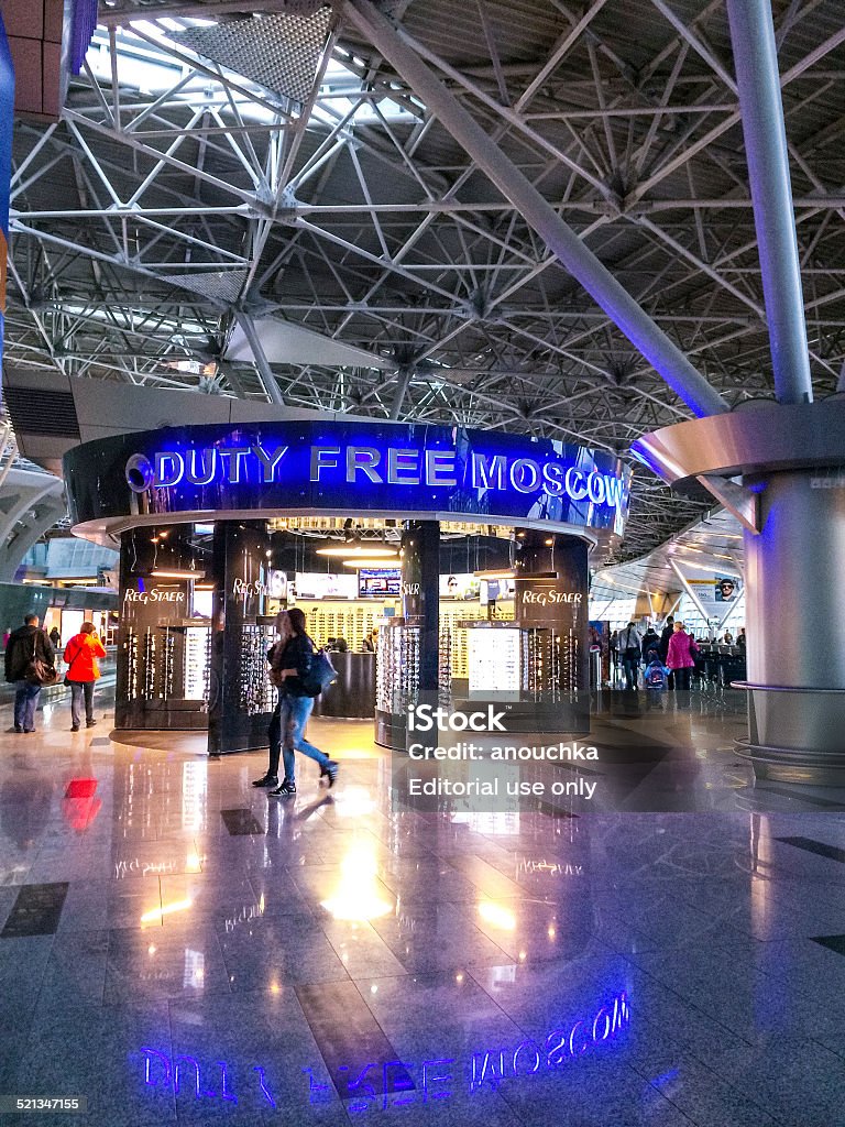 Duty Free Store, Vnukovo International airport,  Moscow, Russia Moscow, Russia - October 18, 2014: Duty Free Store at  Vnukovo International airport,  Moscow, Russia. People walking through the airport Adult Stock Photo