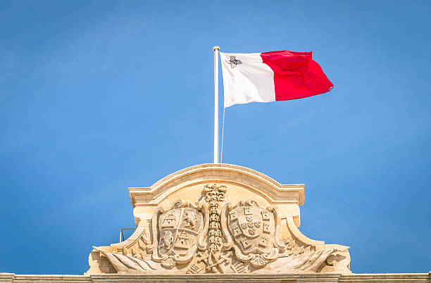 istock Maltese flag against a blue sky - Malta parliament 521347341