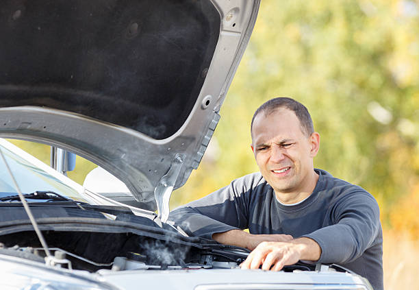 istock man  in a car holding keys 521347685