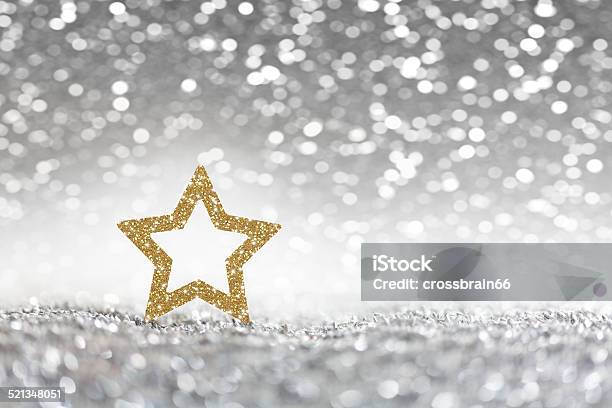 Christmas Golden Christmas Star On Silver Glitter Background Stock Photo - Download Image Now