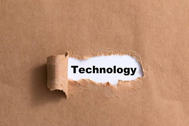 istock word technology on ripped paper isolated background 521348141