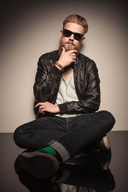 istock Fashion man sitting and thinking 521364857