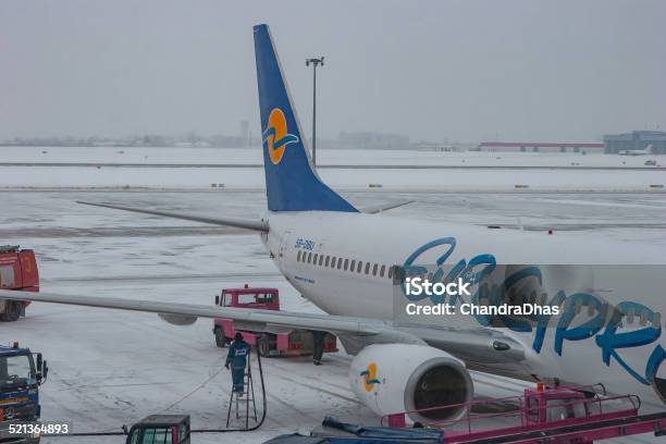 Rzeszov Poland Refuelling Of A Eurocypria Jet Airplane At Jasionka Airport On A Cold Snowy Winters Day Stock Photo - Download Image Now