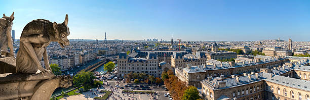 istock Gargoyle looks panorama of Paris 521365931