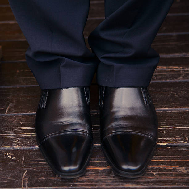 istock men legs in shoes on the floor 521367553