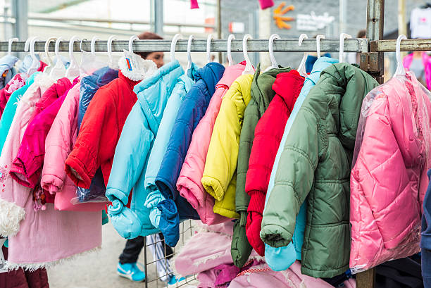 children's clothing store in einem flohmarkt - jacket child clothing fashion stock-fotos und bilder