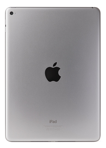 Belen, New Mexico, USA - November 1, 2014: Back side of a space gray Wi-Fi iPad Air 2 with iOS 8.1 by Apple Inc. Announced on October 16, 2014, the iPad Air 2 is now just 6.1 mm thin and weighs less than a pound, It also features an improved Retina display, improved cameras, and Touch ID.