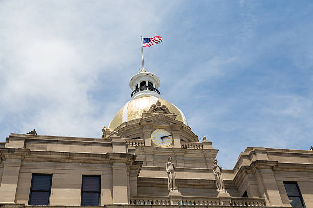istock Clock Gold Dome and American Flag on City Hall 521369245