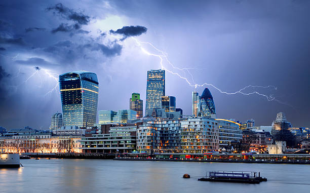 City of London, UK with Lightning City of London, UK lightning tower stock pictures, royalty-free photos & images