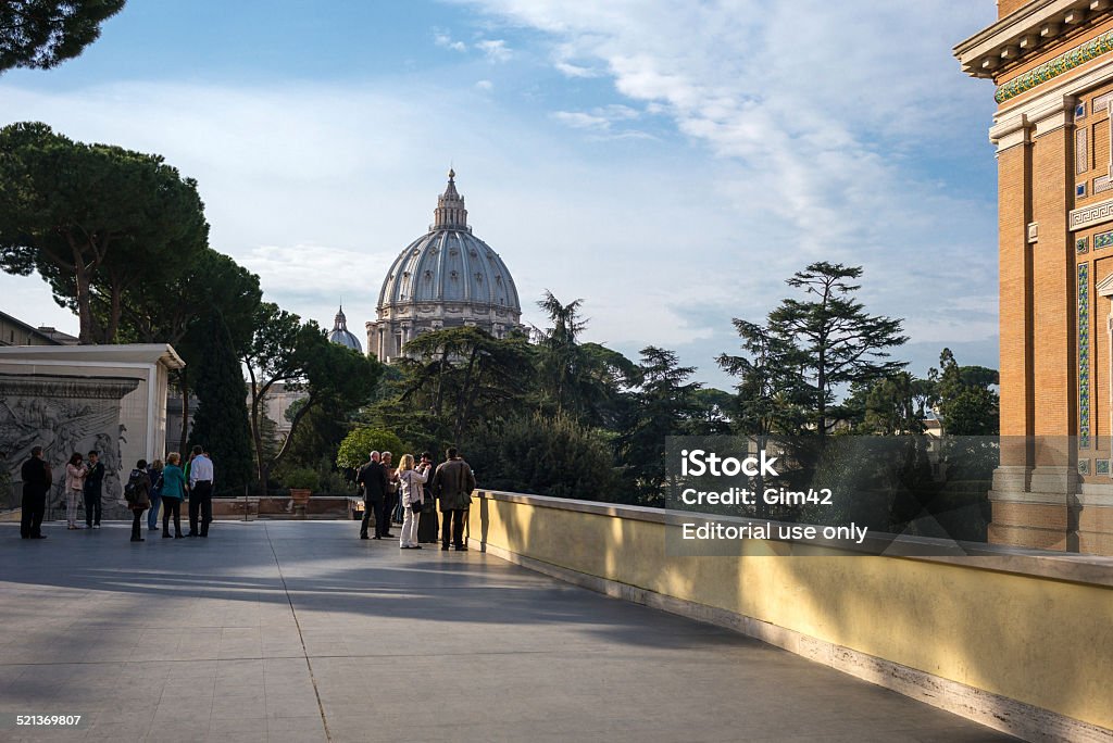 Rome Rome, Italy - March 11, 2014: Visitors in the Vatican Museums terrace with the St Peter Dome in the background Architectural Dome Stock Photo