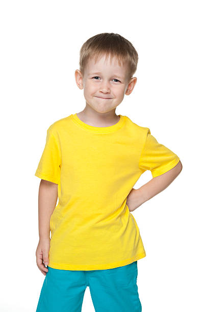 istock Smiling little boy in a yellow shirt 521370119
