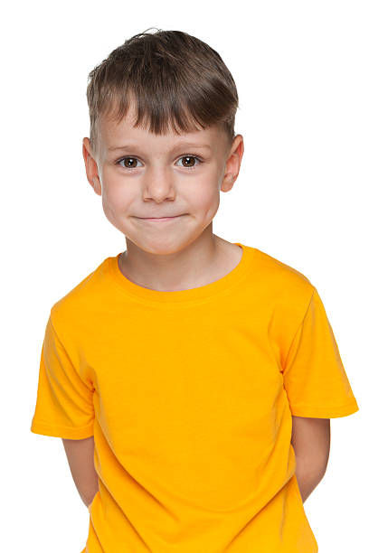 istock Cute little boy in yellow shirt 521370631