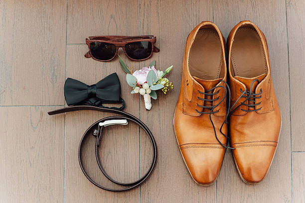 istock groom set clothes. Wedding rings, shoes, bow tie 521371430