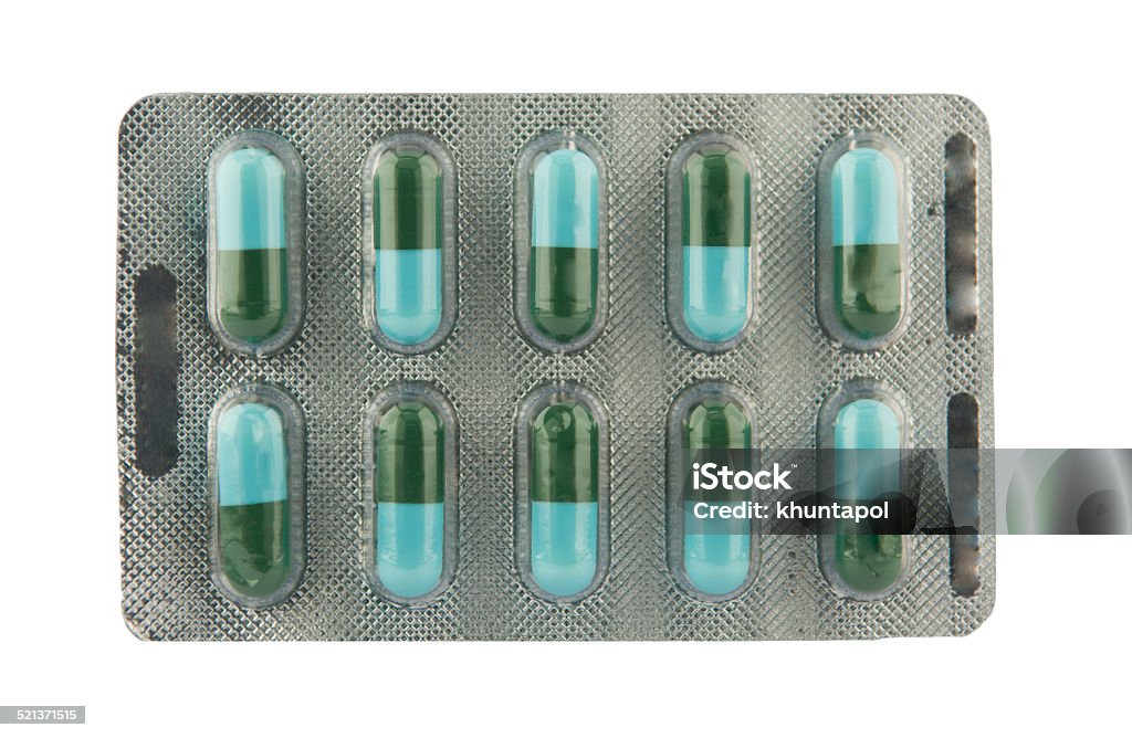 green and blue capsule in blister pack show medicine concept Blister Pack Stock Photo