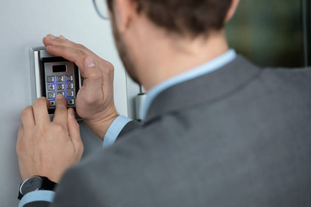 istock Close up of businessman hand pressing button on security system 521374652