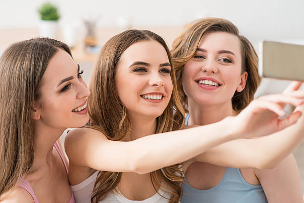 istock Positive girls making photos 521375186