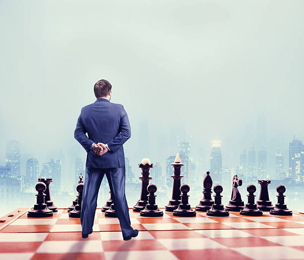 istock Businessman on the chess board 521376156
