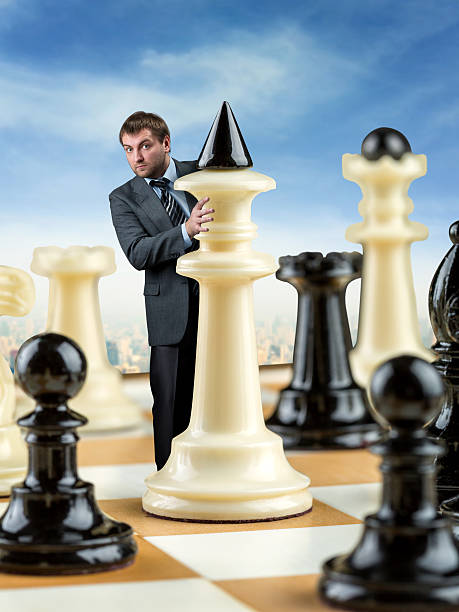 istock Businessman on the chess board 521376780