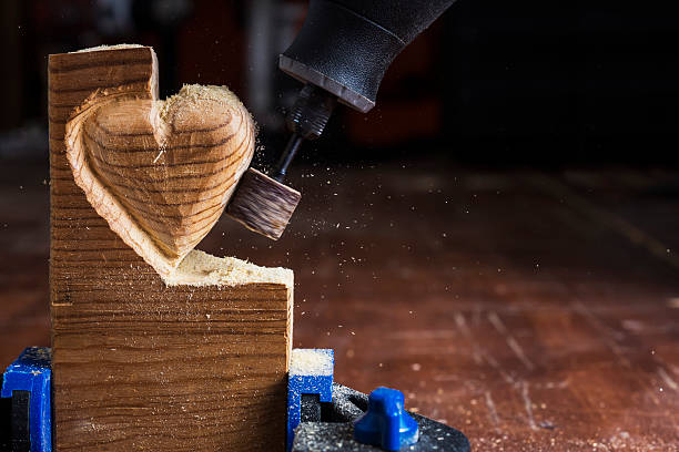 sanding wood heart stock photo