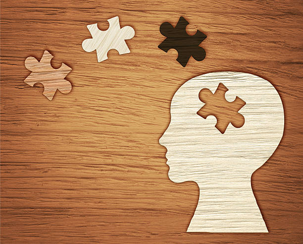 istock Mental health symbol. Human head silhouette with a puzzle 521378722