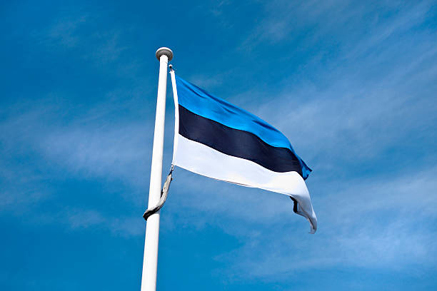 istock Estonian flag in blue sky. 521380553