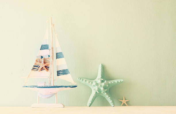 istock wooden boat over wooden textured background. filtered image. 521380704