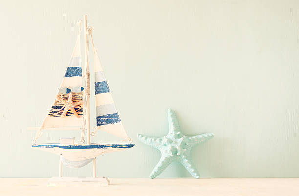 istock wooden boat over wooden textured background. filtered image. 521380928