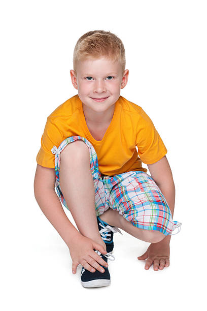 istock Smiling little boy in a yellow shirt 521380945