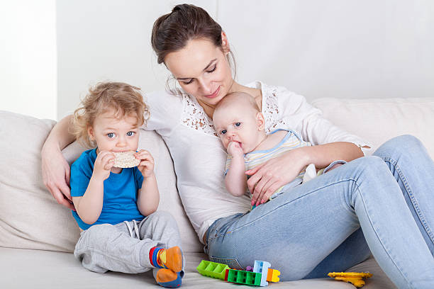 istock Mum with  baby and preschooler 521381739
