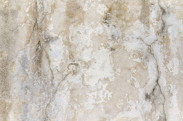 istock Beige gray grunge cracked old wall texture concrete cement background 521381994