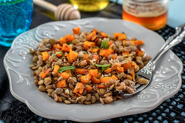 istock Warm lentil salad with baked pumpkin and mint 521382175