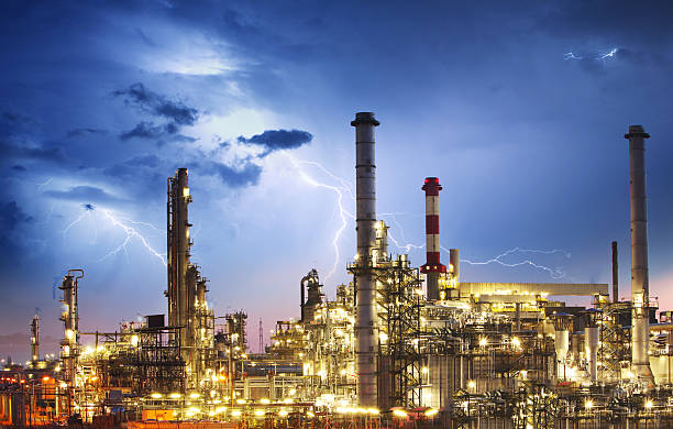 Oil indutry refinery - factory with lightning Oil indutry refinery - factory with lightning lightning tower stock pictures, royalty-free photos & images