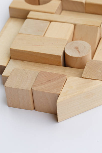 istock Wooden building blocks isolated on white background 521382527