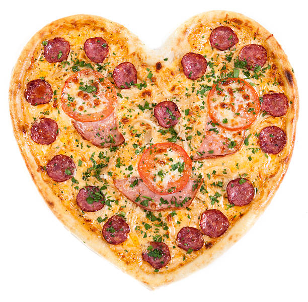 istock pizza in the shape of a heart with tomatoes 521382651