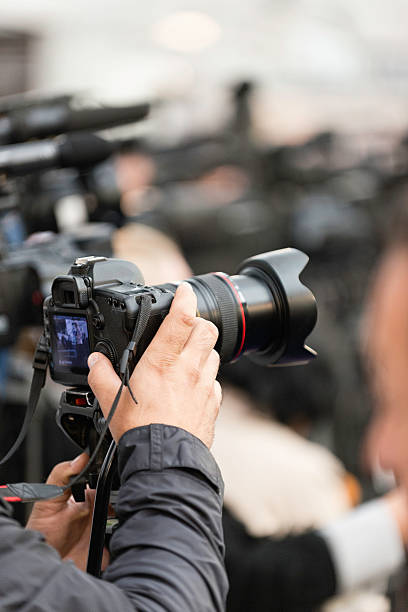istock Photographer on a large press conference 521382941