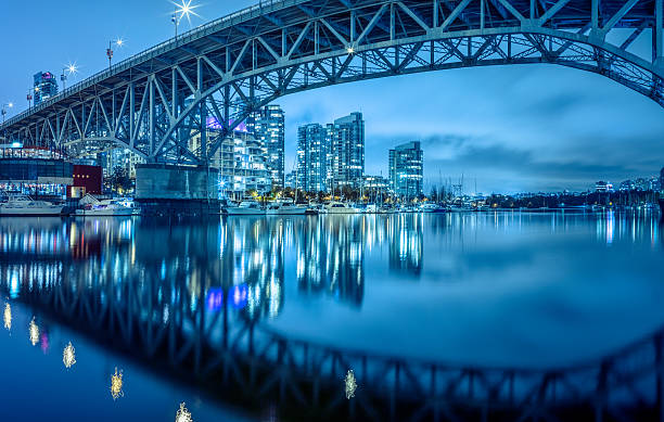 Granville  Bridge at night Vancouver cityscape at night. Colorful city night with skyscrapers and marina with boats. vancouver canada stock pictures, royalty-free photos & images