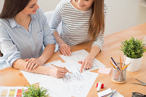 istock Positive girls sitting at the table 521384392